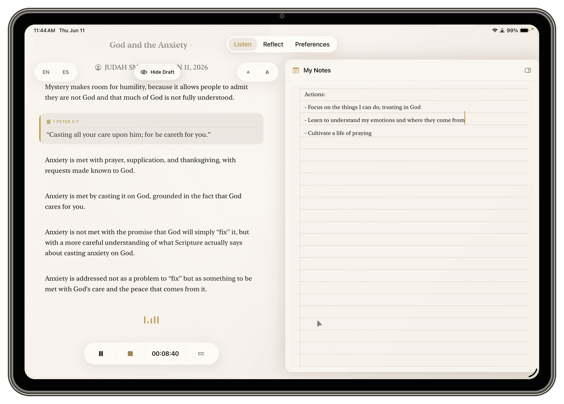 iPad in landscape during a live session, with the journal beside a ruled-paper notebook for handwritten notes
